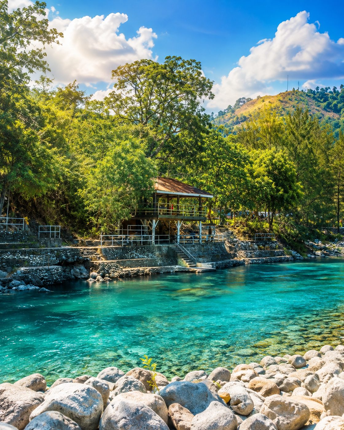 Turquoise river pool and stone banks at Coto Kidz Pool in Taltal, Masinloc